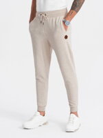 Men's sweatpants in pleasant knit fabric - cream melange V1 OM-PASK-0131